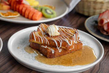 variety of breakfast items, breads, eggs, waffles, cereals, and cheeses