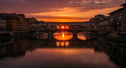 Obraz premium Stunning Sunset Reflection of Ponte Vecchio Bridge in Florence Italy.