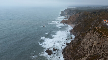 Experience stunning coastal landscapes with waves crashing against rugged cliffs