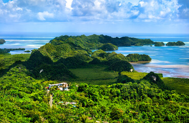 Stunning high angle view of the lush landscape of Airai, the main island of Palau, and the surrounding Pacific Ocean on a beautiful sunny day. Micronesia, Oceania