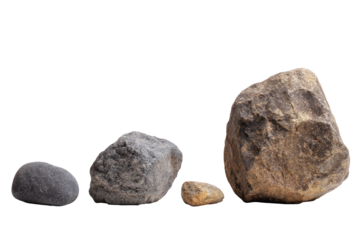 Four stones of varying sizes arranged in a horizontal row, set against a solid black background.  The stones range from small to large, showing different shades of gray and brown