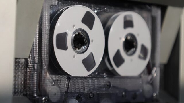 Transparent audio cassette with reel-to-reel spinners seamless loop