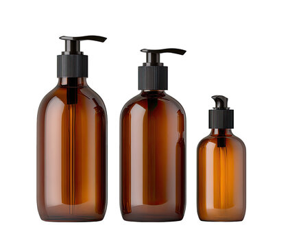 Three amber glass bottles with black pump dispensers, arranged in varying sizes