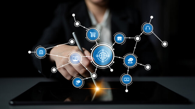 A business professional interacts with a digital tablet, showcasing connectivity symbols and technology icons. Ideal for showcasing modern communication and innovation. Tessel