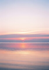 Naklejka premium Pastel Sunrise Reflecting on Calm Ocean Waters Serene Beauty