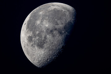 half moon on black background with crater detail © DrN8