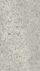 Seamless Terrazzo floor texture with small evenly distributed chips in uniform base color featuring lighter and darker g