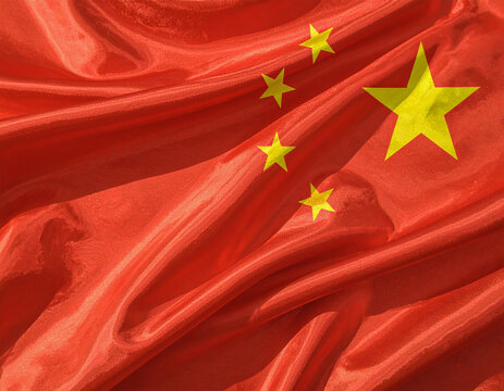 Close-up Chinese national flag with golden stars on red fabric, detailed textile texture, symbolizing patriotism, unity, and national pride.

