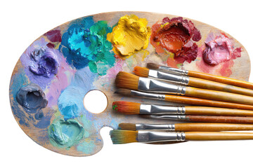 Obraz premium Wooden artist's palette with colorful paint and brushes