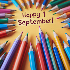 Colorful pencils arranged in a circular pattern around a message that reads 'Happy 1 September!' on a yellow background