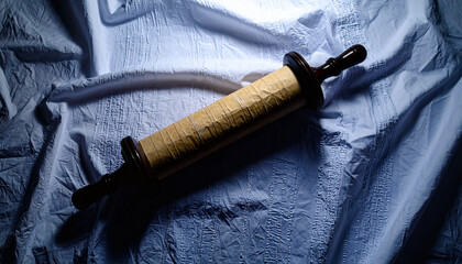 Naklejka premium Torah Scroll Top Down View on White Linen Surface. Jewish festival concept. Generated Image
