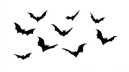 A flock of black silhouette bats flying in a scattered formation against a white background
