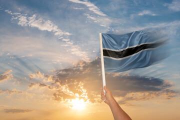 National flag of Botswana waving in people hand on Independence day