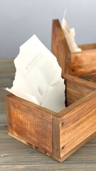 Wooden storage boxes with crumpled paper