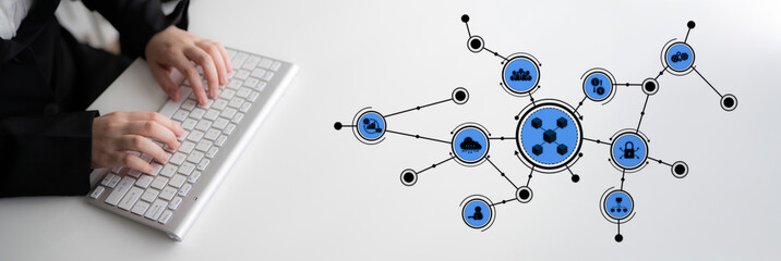 A close-up of hands typing on a keyboard beside a blue node network graphic, symbolizing modern...