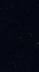 Fototapeta premium A dark night sky filled with countless stars, creating a vast and awe-inspiring celestial scene.