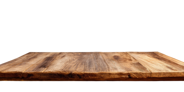 Close-up of a light brown wooden table top against a black background.  The wood grain is visible, running horizontally across the surface.  The edge of the table is slightly irregular