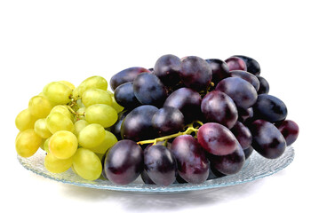 yellow and blue grapes on white plate