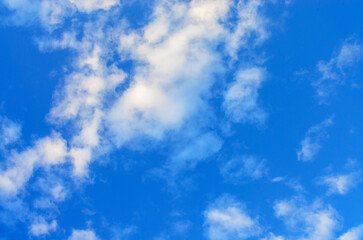 Beautiful blue sky with fluffy white clouds creating natural scenic background