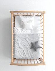 Baby crib with white bedding and grey star pillow
