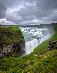 Dramatic waterfall cascading down rocky cliffs