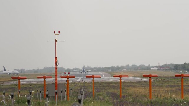 Long shot, passenger airplane taxiing to the runway at Almaty International Airport.
