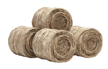 Stacked bales of light beige,  natural fiber.  Close-up view