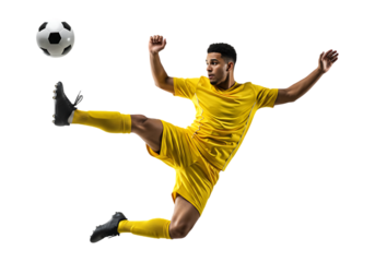 Soccer player in yellow uniform kicking a ball isolated on transparent background