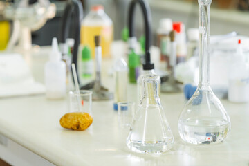 Laboratory glassware and equipment on table