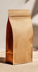 A light brown, stand-up pouch with a resealable top sits on a neutral-toned surface, subtly illuminated by soft, diffused light casting shadows