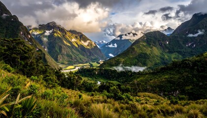 Fototapeta premium Lush valley nestled in mountainous terrain
