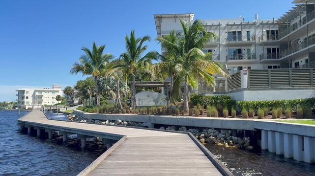 Walking along the Stuart Riverwalk boardwalk along the St. Lucie River in downtown Stuart in Martin County, Florida. 