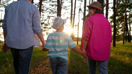 Happy family dad mom son travel in nature. Family vacation concept in nature. Parents son child...