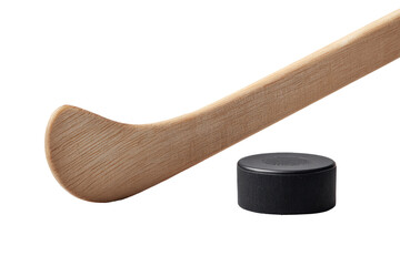 Light-colored wooden hockey stick angled, with a dark puck