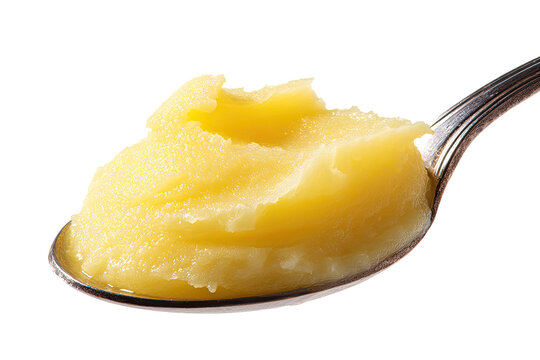 Creamy, golden-yellow ghee on a spoon