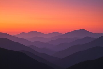 Fototapeta premium Layers of mountains at sunset create a serene and scenic landscape