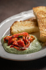 Toast with creamy herb dip and roasted peppers