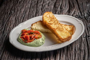 Toast with creamy herb dip and roasted peppers