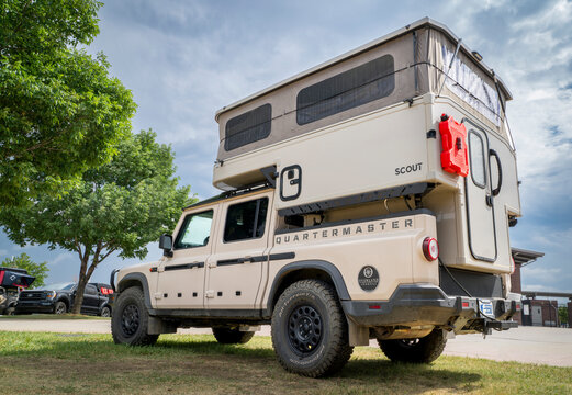 Loveland, CO, USA - August 22, 2025: Ineos Quartermaster pickup truck with Scout camper - setup for for offroading and overlanding.