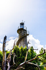 lighthouse on the top of a hill