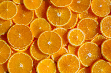 Fresh Orange Slices Arranged in Rings on Table