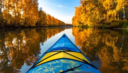 Kayaking through golden autumn foliage
