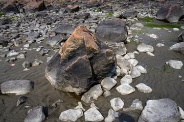 Nature’s art, beautiful and colorful rocks on the coast of Hudson Bay, Manitoba, Canada, as a nature background
