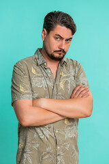 Middle-aged man looks away showing clear offense with slightly protruding lower lip furrowed...