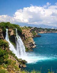 Obraz premium Waterfall cascading into the ocean
