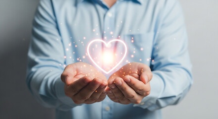Warm glowing heart held gently in caring hands, radiating hope and love