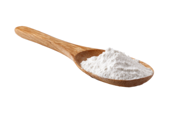 Wooden spoon holding a pile of white powder