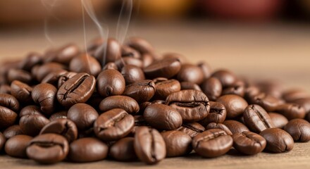 Obraz premium Close up shot of a pile of roasted coffee beans with visible smoke on a wooden table