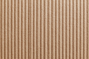 Close-up of corrugated cardboard.  Beige, textured, parallel lines
