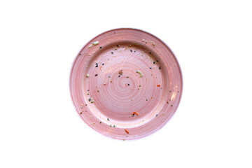 Top view of empty dirty pink plate with food scraps and stains on white background, concept of food waste, leftovers, dining, cleanup, and sustainability in kitchen or restaurant.